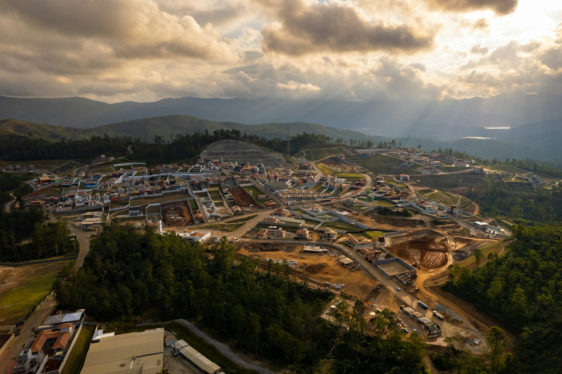 An aerial view of a construction site under a cloudy sky